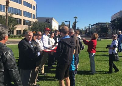 Dave Giles helping Fold USS Arizona Flag
