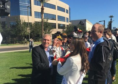 Dave Giles helping Fold USS Arizona Flag with Miss Arizona
