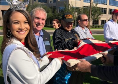 Dave Giles helping Fold USS Arizona Flag with Miss Arizona