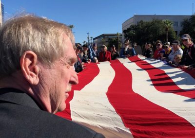 Dave Giles helping Fold USS Arizona Flag